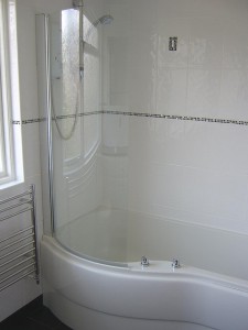 Finished Bathroom with white wall tiles 