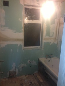 Bathroom wall boarded ready for tiling