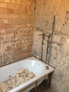 Removed the original wall tiles exposing the brick wall