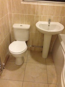Bathroom suite with toilet and sink