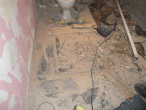 Cut out the floor for the hot water pipes