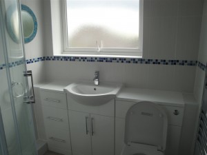 White Bathroom Tiles with Blue Mosaic Border