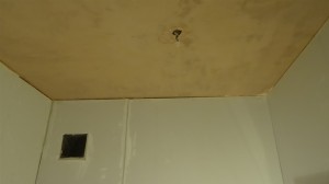 Boarded Wall and Plastered Ceiling