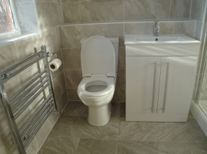 Grey Stone Effect Floor Tiles with Toilet, towel warmer and Vanity Basin