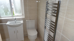 Vanity Basin Toilet and Towel Warmer fitted in Shower Room
