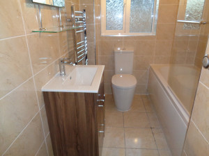 New Bathroom Fully Tiled with Dark Brown Vanity Basin
