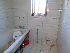 Bathroom Walls and Bathroom Floor Tiled with Ceramic Tiles