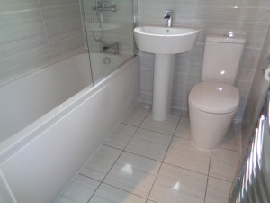 Refitted Bathroom with Modern Basin and Bath Taps