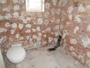 Bathroom taken back to brick removing bathroom, tiles and plaster board