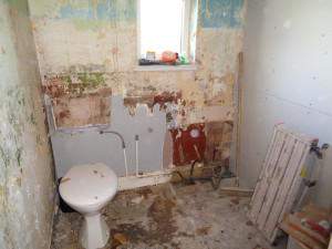 Bathroom going back to brick removing bathroom suite and wall tiles