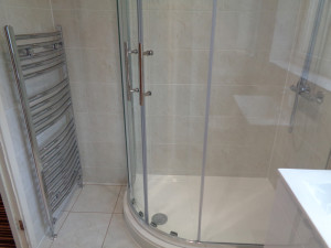 Curved Shower with Chrome Towel Warmer