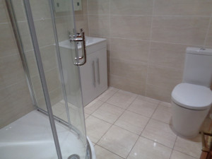 Curved Shower Tray with Shower Screen, storage vanity basin and modern easy clean toilet