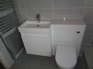 Modern Bathroom Sink and Toilet Storage with Towel Warmer
