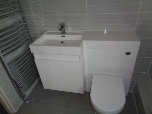 Modern Bathroom Sink and Toilet Storage with Towel Warmer