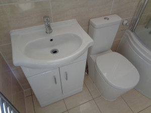 Bathroom Vanity Basin with Easy Clean Toilet and Beige Bathroom Tiles