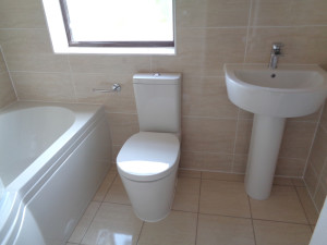 New Bathroom with Beige Tiles and Fitted Bathroom