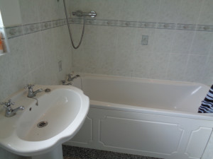 Bathroom in Stratford Upon Avon house, bath and pedestal basin
