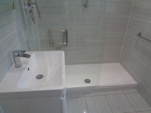 Walk In Shower With Wall Fitted Shower Seat and Hand Rails