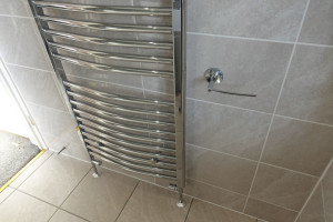 Wall to Wall Vanity Fitted Furniture Finished With boxed Tile area Above Bath  