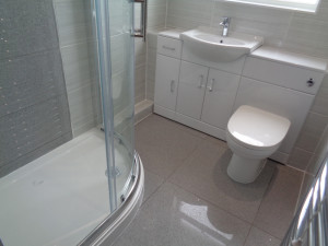 Feature wall tiled panel and wall to wall vanity bathroom storage