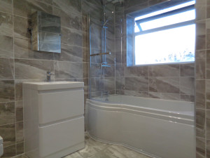 P Shaped Shower Bath Bathroom Mirror and Grey Bathroom Tiles