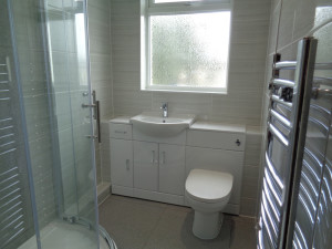 Quadrant Shower With Wall to Wall Fitted Bathroom Furniture