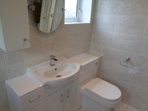 Fitted Bathroom furniture including toilet, storage sink and cupboard