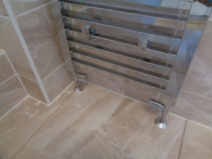 Chrome pipe work on a chrome towel warmer