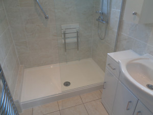Walk In Shower with Tiled Bathroom Walls and Floor