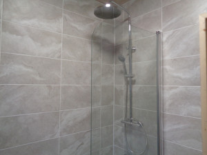 Wall mounted thermostatic chrome shower and glass shower screen