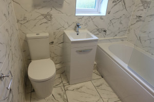 Bathroom with marble effect tiles Warwick