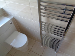 Vanity Toilet with Wall hung chrome towel warmer