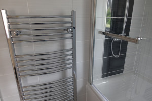 Chrome towel warmer 120cm by 60cm fitted in bathroom 