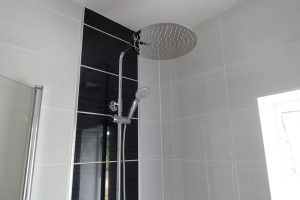Exposed wall mounted thermostatic shower that’s runs off combi boiler