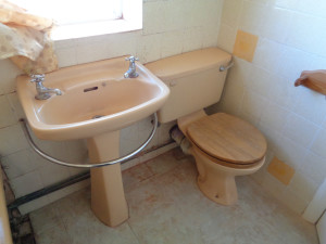 Old Bathroom with Old Basin and Toilet