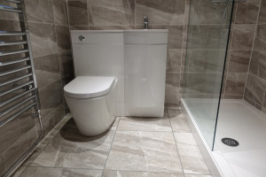 Walk In Shower with Grey Walls and Floor Tiles In Coventry Home