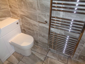 shower room is heated with a large chrome towel warmer 60cm wide and 120cm high