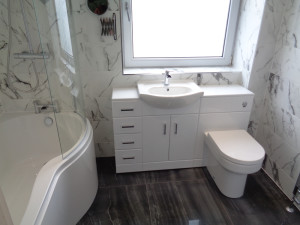 Luxury Bathroom Renovation with Storage and Marble Effect wall and floor tiles
