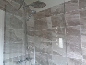 Chrome wall mounted thermostatic shower fitted to British Ceramic Tiles Grey Astbury Wall Tile