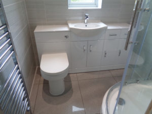 Bathroom Storage offered with wash basin toilet with built in cupboards and draw units