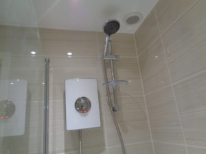 ceiling extractor fan was repositioned to sit directly above the shower area