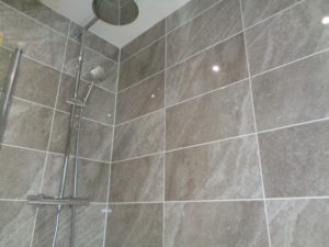 Large wall mounted rain shower running from combination boiler