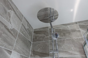 Wall mounted chrome thermostatic shower with large rain head and hand held remote shower head