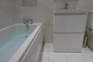 Bath fitted with straight bath and 60cm vanity storage basin