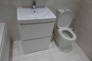 Bathroom fitted with easy clean toilet and 60cm vanity unit
