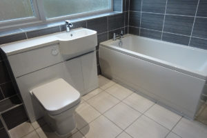 Bathroom fitted with straight bath