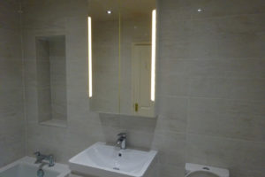Bathroom with fitted led cabinet mirror
