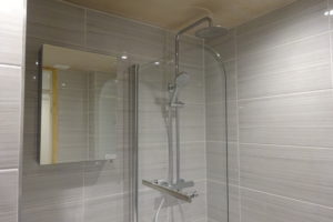 Bathroom with wall cabinet and Tavistock Thermostatic shower