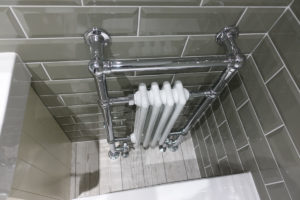 Traditional bathroom towel warmer in white and chrome