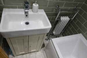 Traditional bathroom vanity basin towel warmer